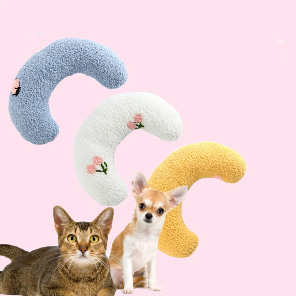 Small U-shaped plush pet pillow in blue for cats and small dogs on a white background.