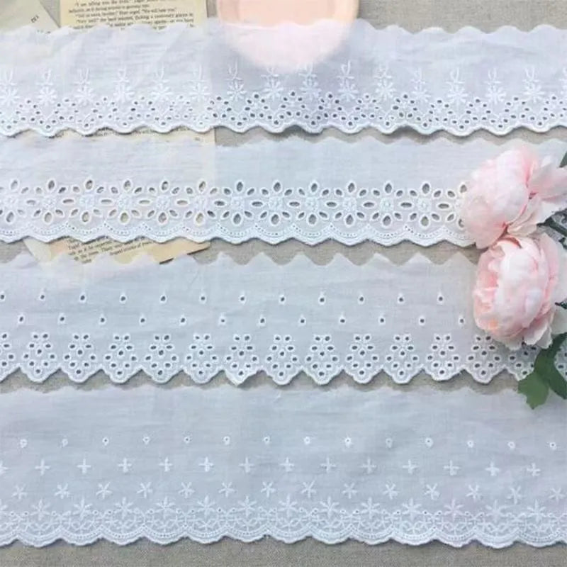 Cotton embroidered lace trim roll showing four different openwork pattern styles for DIY clothing