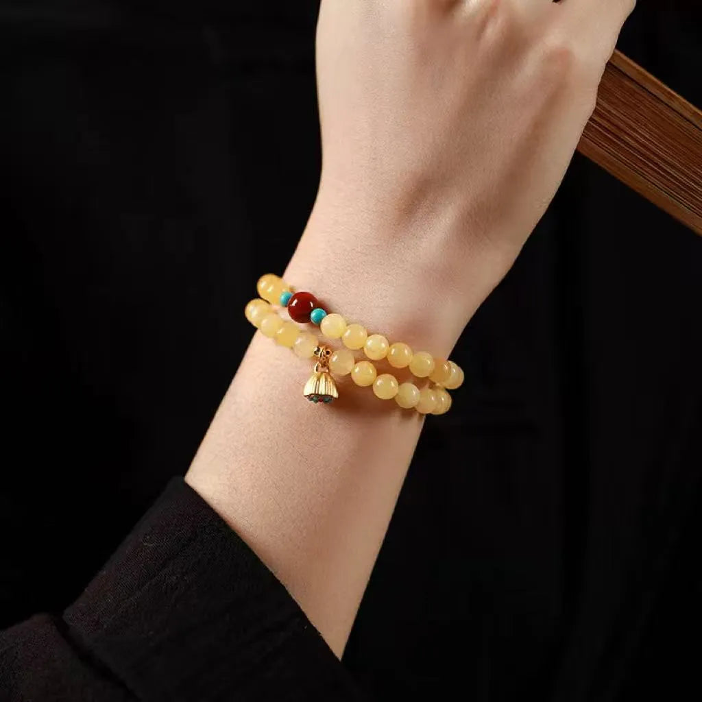 Yellow jade handmade bracelet with lotus seedpod design and double ring structure