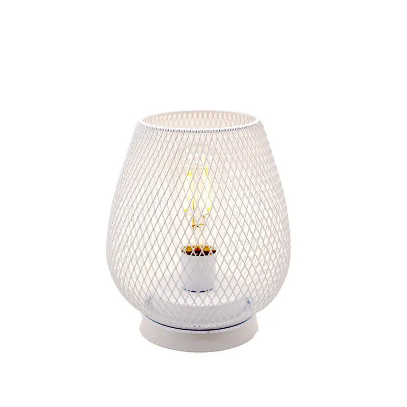 Retro iron art battery powered birdcage table lamp with warm light on bedside table