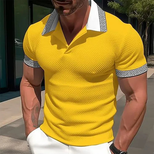 Man wearing a loose-fit striped short-sleeve t-shirt in a casual setting.