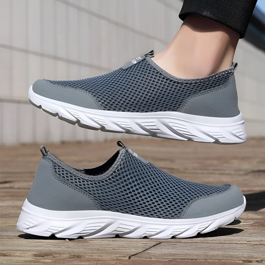 Large size mesh low-top casual sneakers with EVA sole, round toe, and sewing thread detail in grey, dark blue, black and white, or all black.