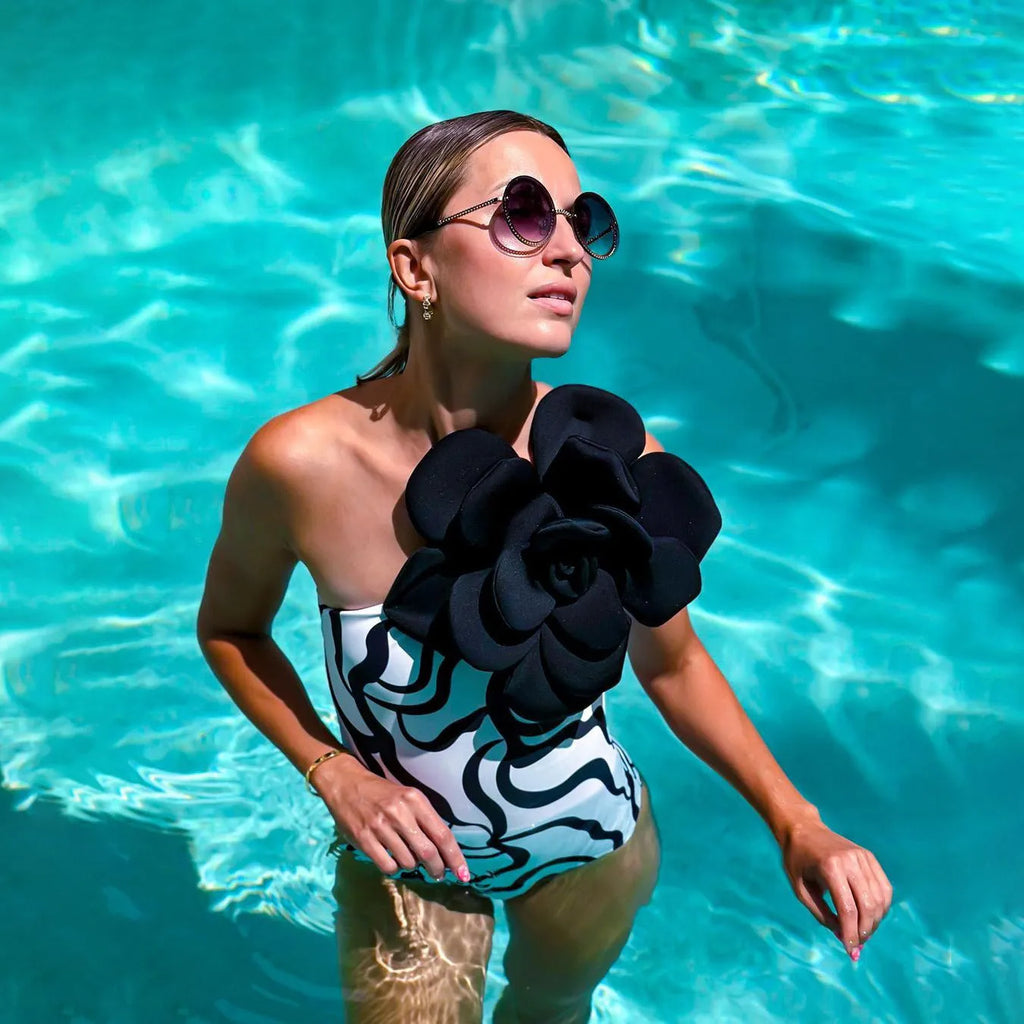 Women's solid colour one-piece swimsuit with European fit in a floral pattern design.