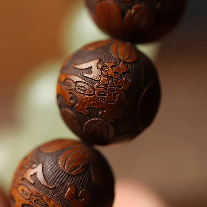 Rosewood flexible bracelet with fu character carving showing 12 wooden pieces connected by flexible cord