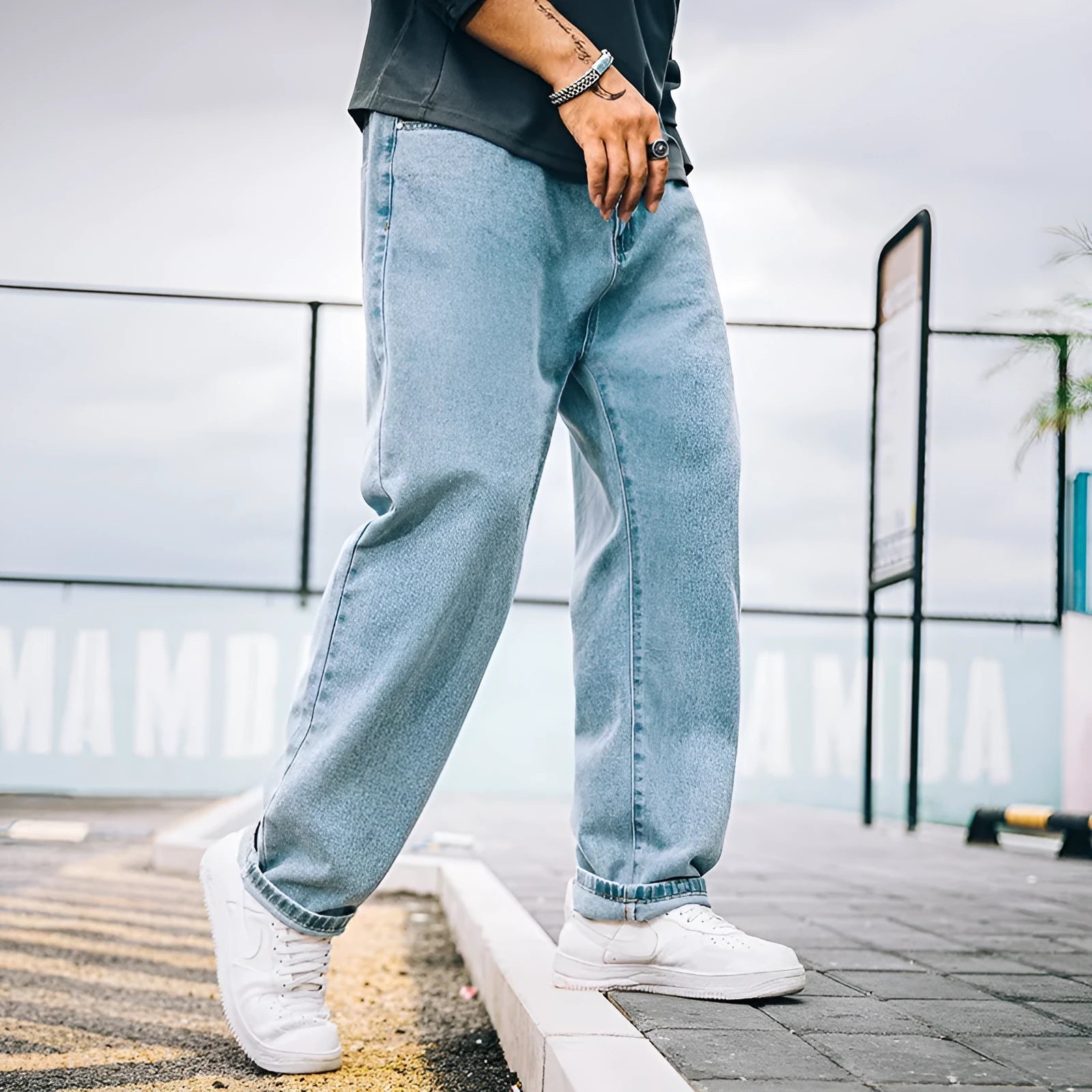 Men's loose straight leg casual jeans in cotton, shown in dark blue, light blue, and grey colours.