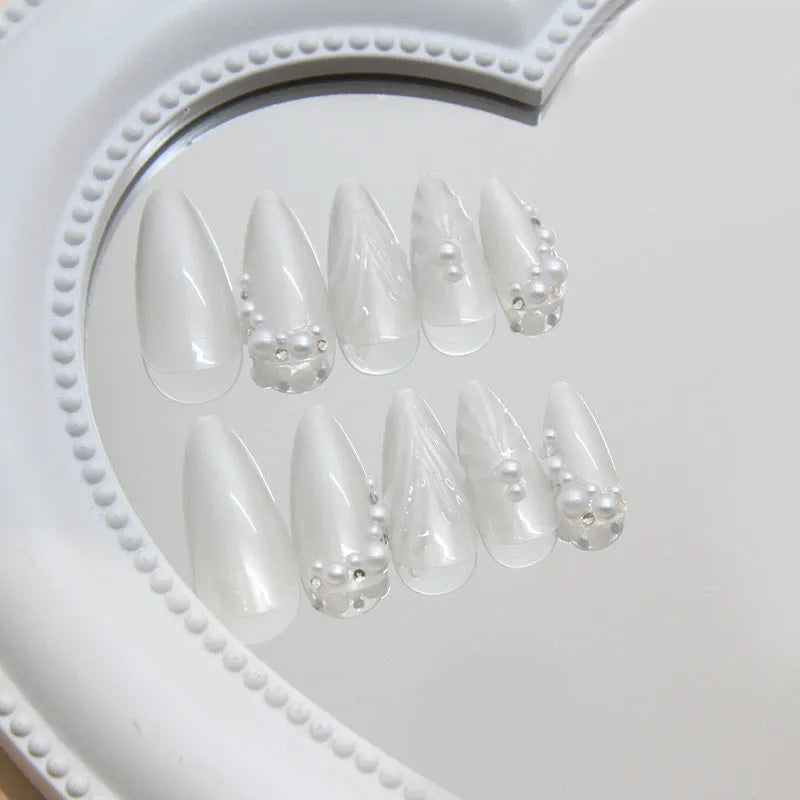 24 pieces of white press-on artificial nail tips with diamond sparkle finish in a pack