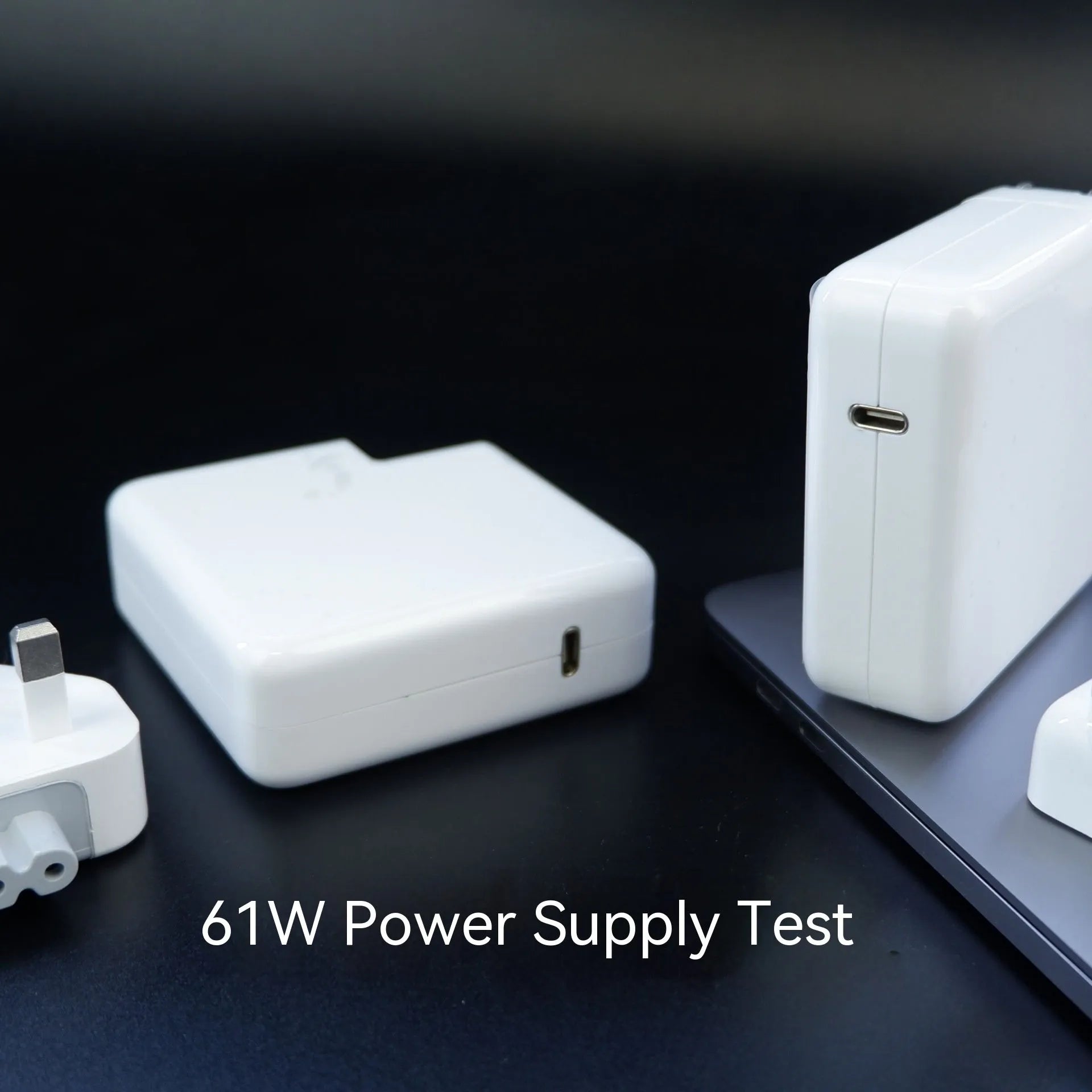 61W laptop power adapter charger with international plug options, 7cm by 7cm by 3cm dimensions