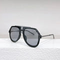 Black leopard print large frame retro sunglasses with elliptical lenses on a table next to their lens cloth and box.