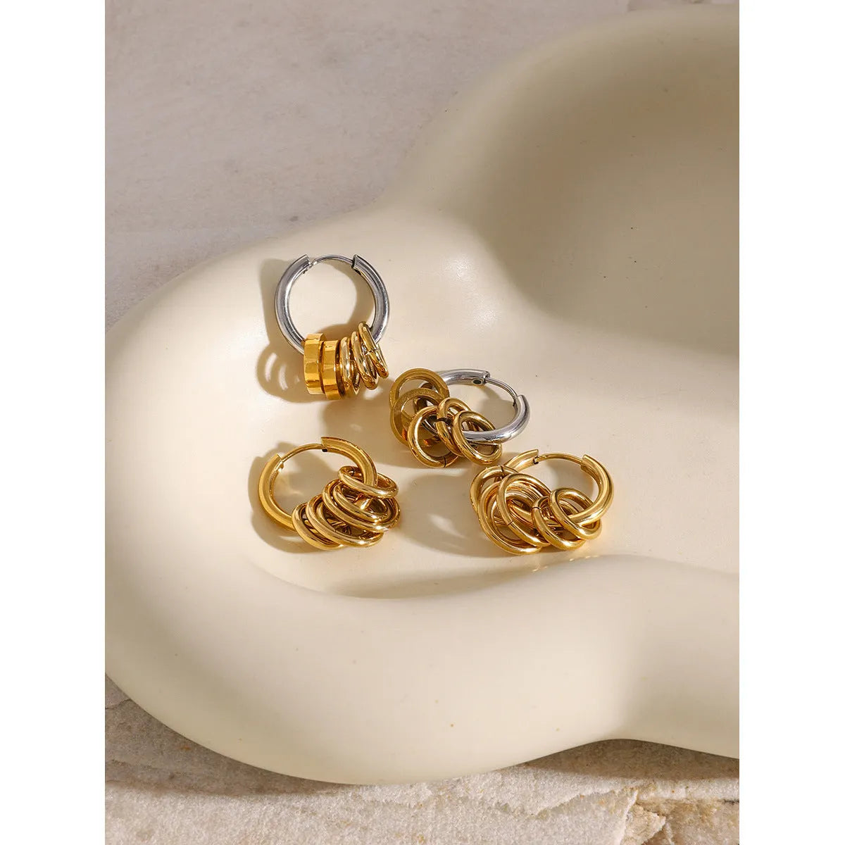 Stainless steel electroplated earrings in INS style, available in two colour options.