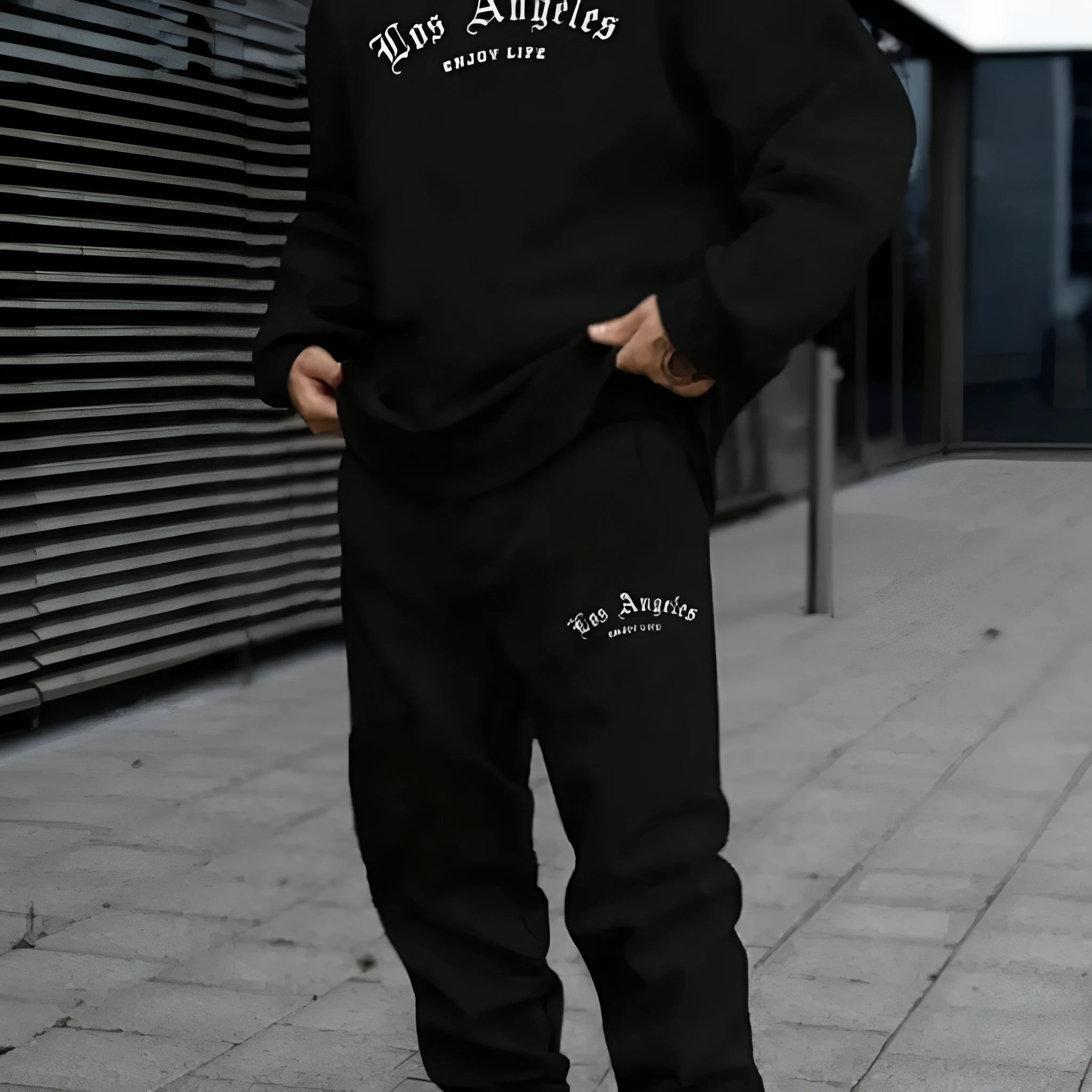 Men's grey hooded pullover sweater and matching trousers set for winter sports leisure.