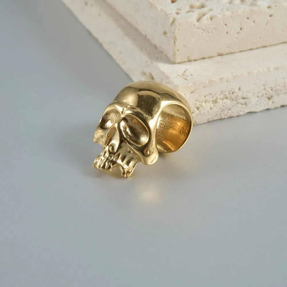 Stainless steel hollow skull and Buddha head design earrings in four colour options.