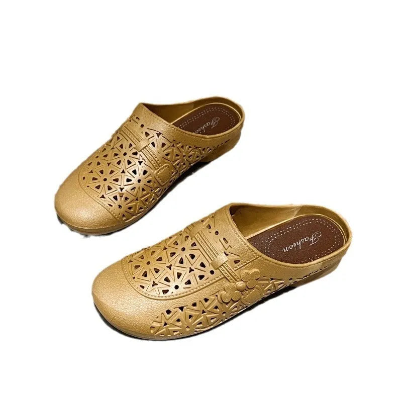 Flat toe box PVC fairy style half slippers in apricot colour on a plain background.