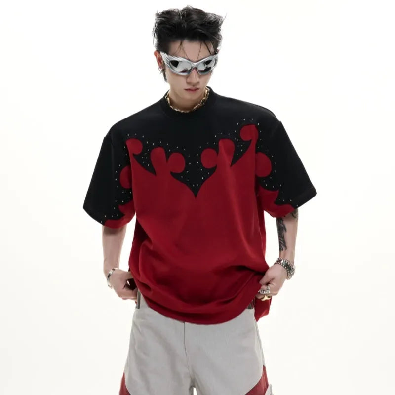 Grey men's loose-fit cotton T-shirt with textured 3D stitching and burnt flower detail on chest, short sleeves, round neck.