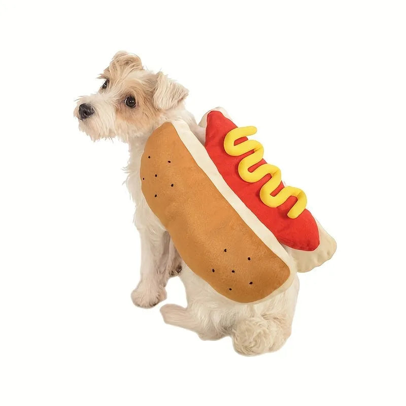Small dog wearing a funny brown and beige full-body hot dog costume with bun sleeves.