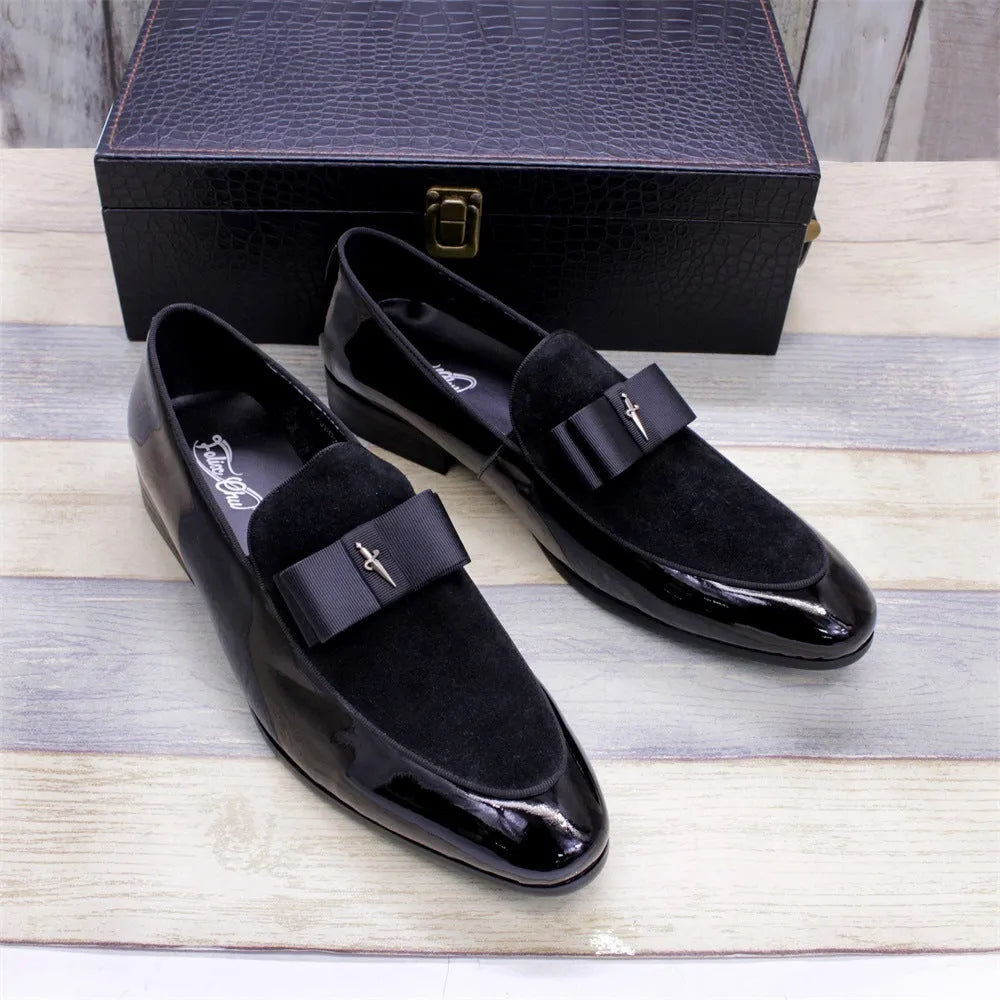 Men's glossy black patent leather low-top shoes with a tassel detail on a white background