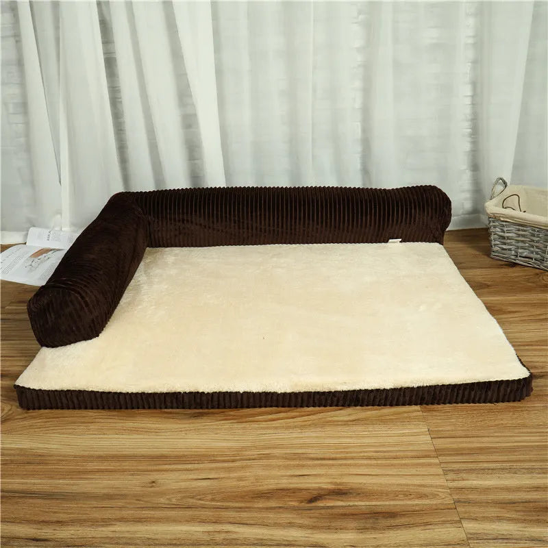 Large grey corduroy dog sofa bed with raised sides on a wooden floor