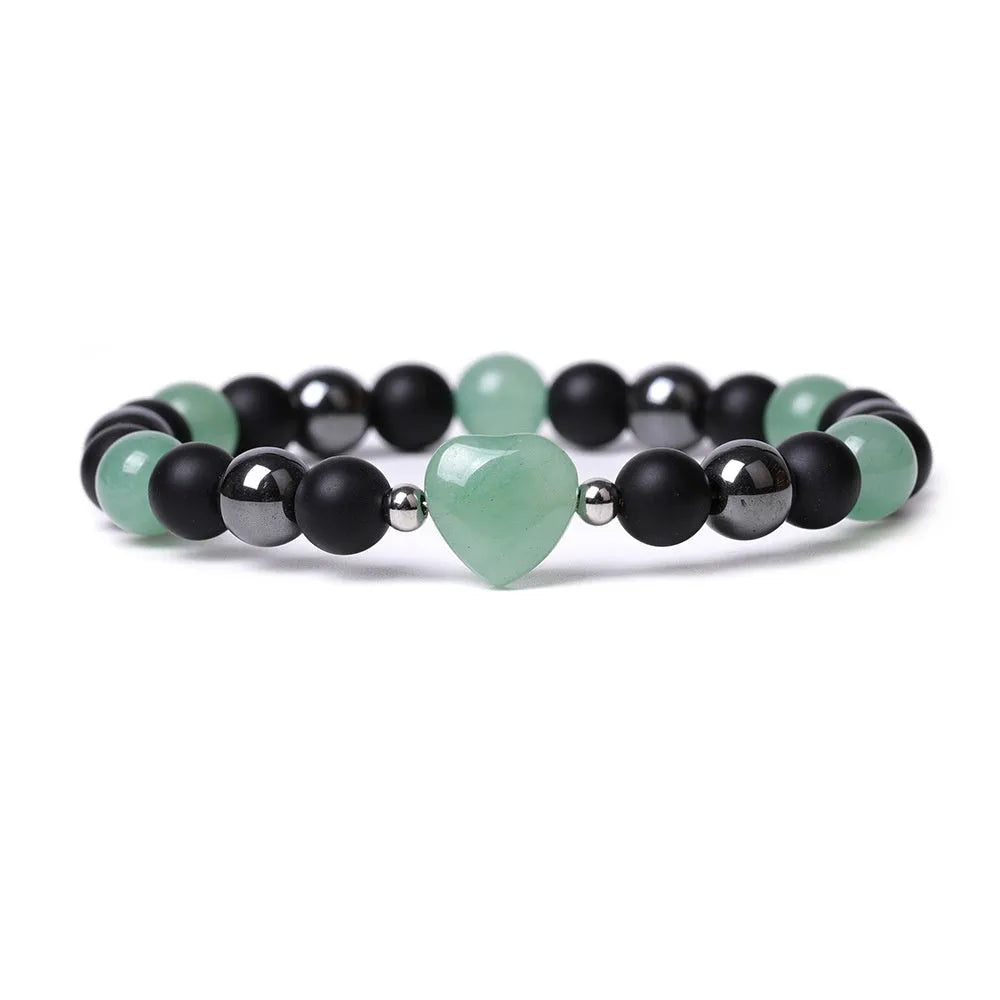 Hand-cut peach heart stone bracelet with geometric moon planet design in Tigereye colour