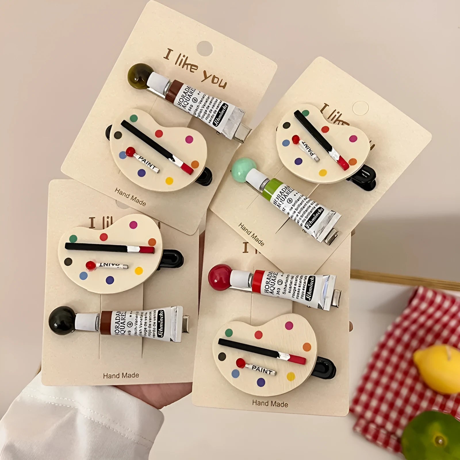 Two plastic duckbill hair clips for women in green, red, and brown colour options for art drawing use