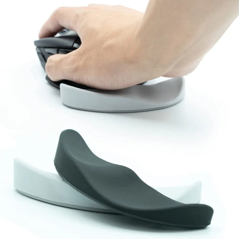 Ergonomic silicone gliding mouse wrist rest for right-handed use, black, 10 x 4.5 x 5 cm, on desk with computer mouse