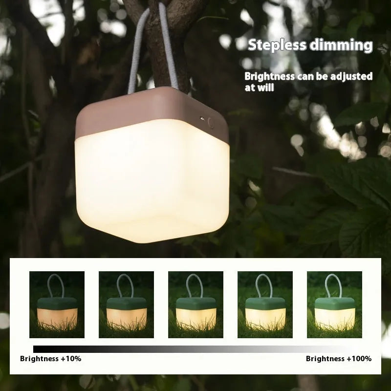 LED hanger solid color portable rechargeable light in green with remote control on a table