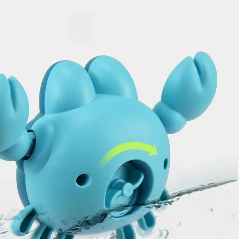 Clockwork crab and turtle bath toys floating on water – pink and blue options