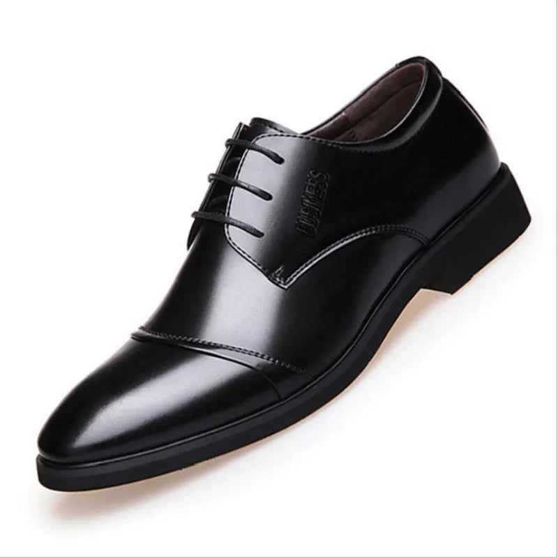 Men's black formal lace-up shoes with decorative stitching and horse buckle detail on rubber sole