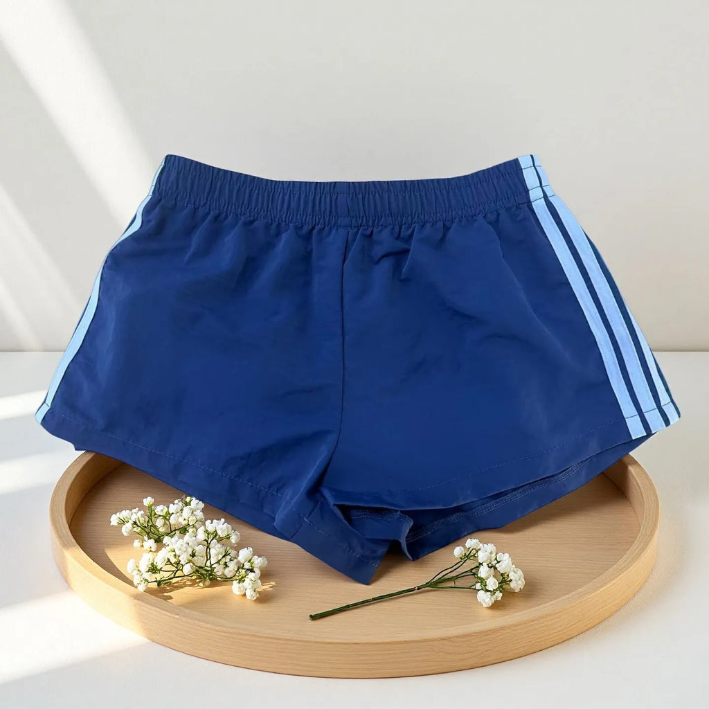 Men's navy blue high waist nylon sports shorts with micro elasticity on a white background