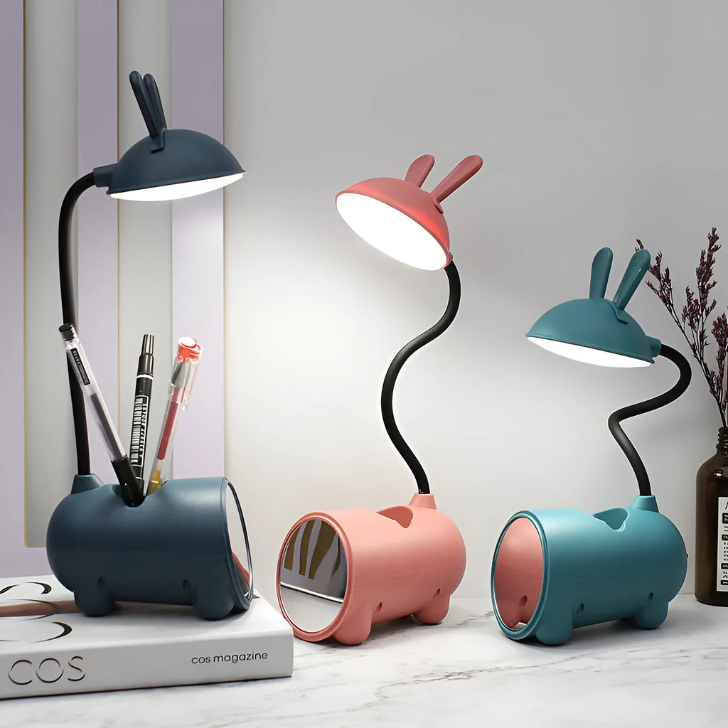 Cartoon-themed plastic desk lamp with USB power and pen storage compartment in dark blue colour