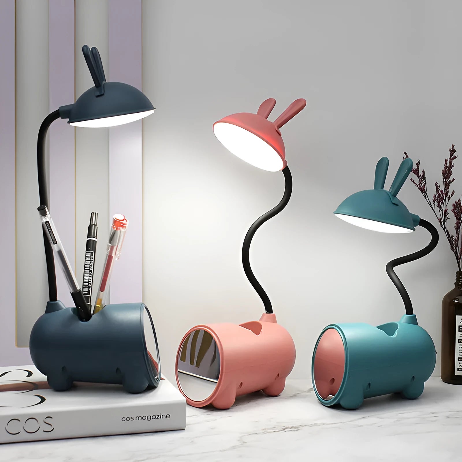 Cartoon-themed plastic desk lamp with USB power and pen storage compartment in dark blue colour