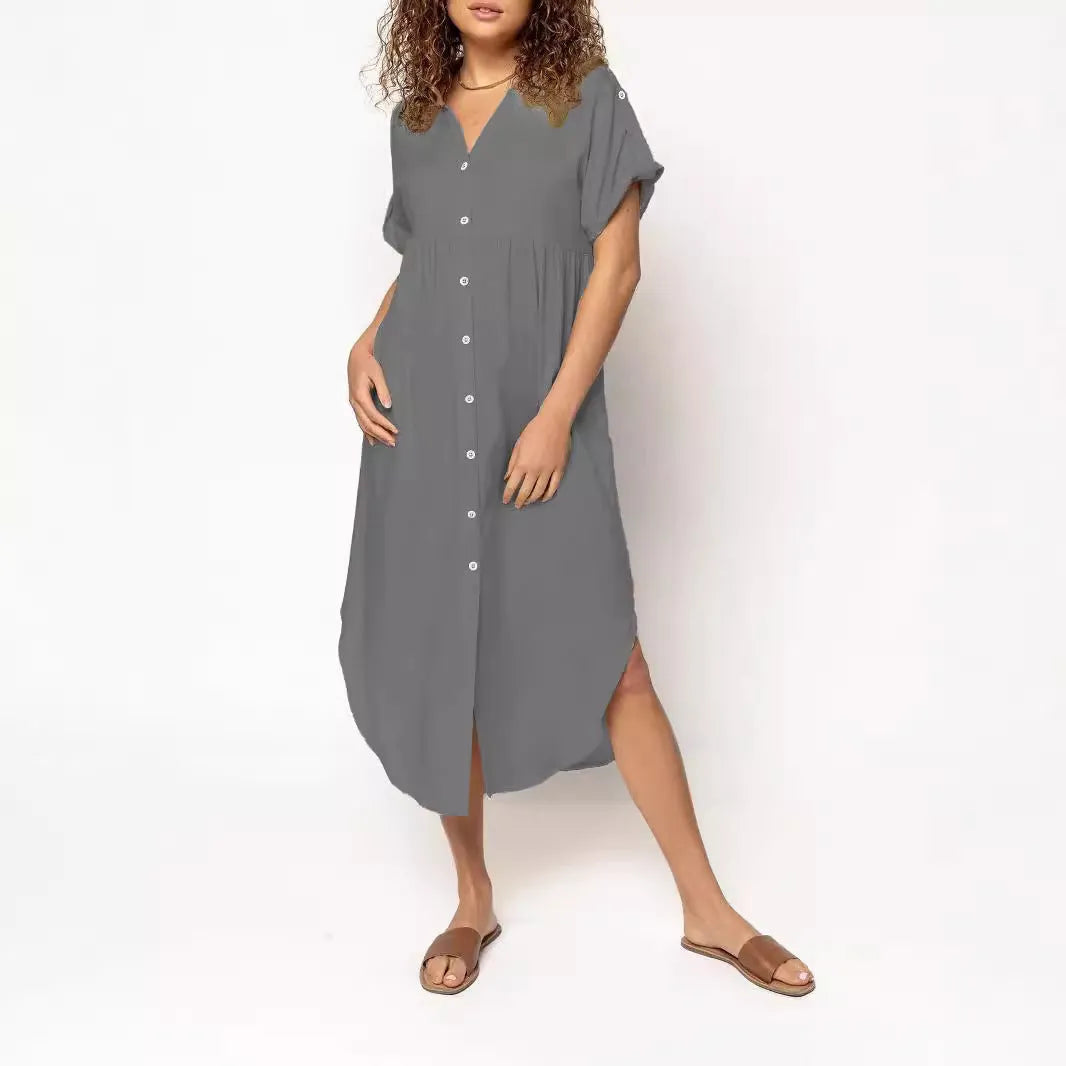A loose-fitting mid-length casual dress with a button-down front, shown in a solid colour.