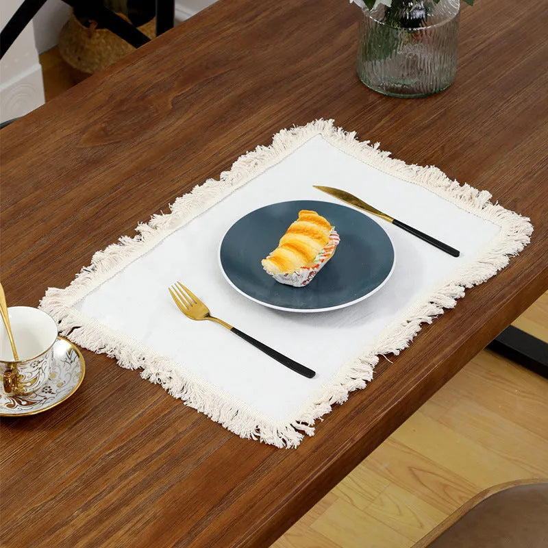 Square polyester placemat in beige or white, sizes 30x30cm and 45x30cm, for dining table protection.