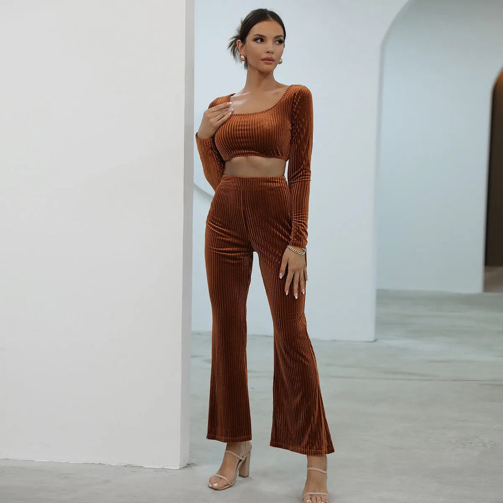 Caramel-coloured women's long sleeve knit sweater and matching trousers laid flat, a two-piece loungewear set.