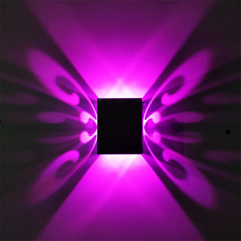 Modern aluminium butterfly-shaped LED wall lamp with remote control for colour changing.