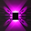Modern aluminium butterfly-shaped LED wall lamp with remote control for colour changing.