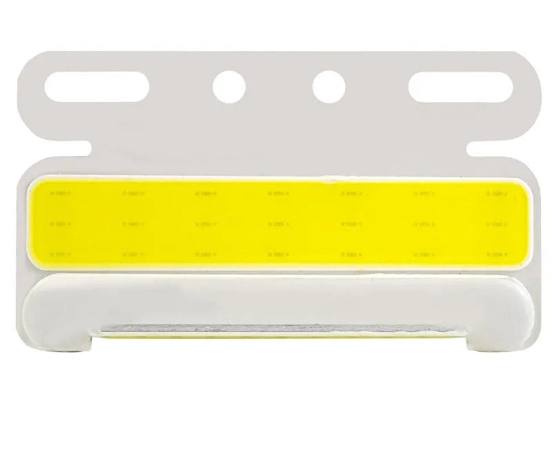 Waterproof aluminium alloy LED side light for trucks, showing bright COB illumination in blue, mounted near a vehicle tyre.