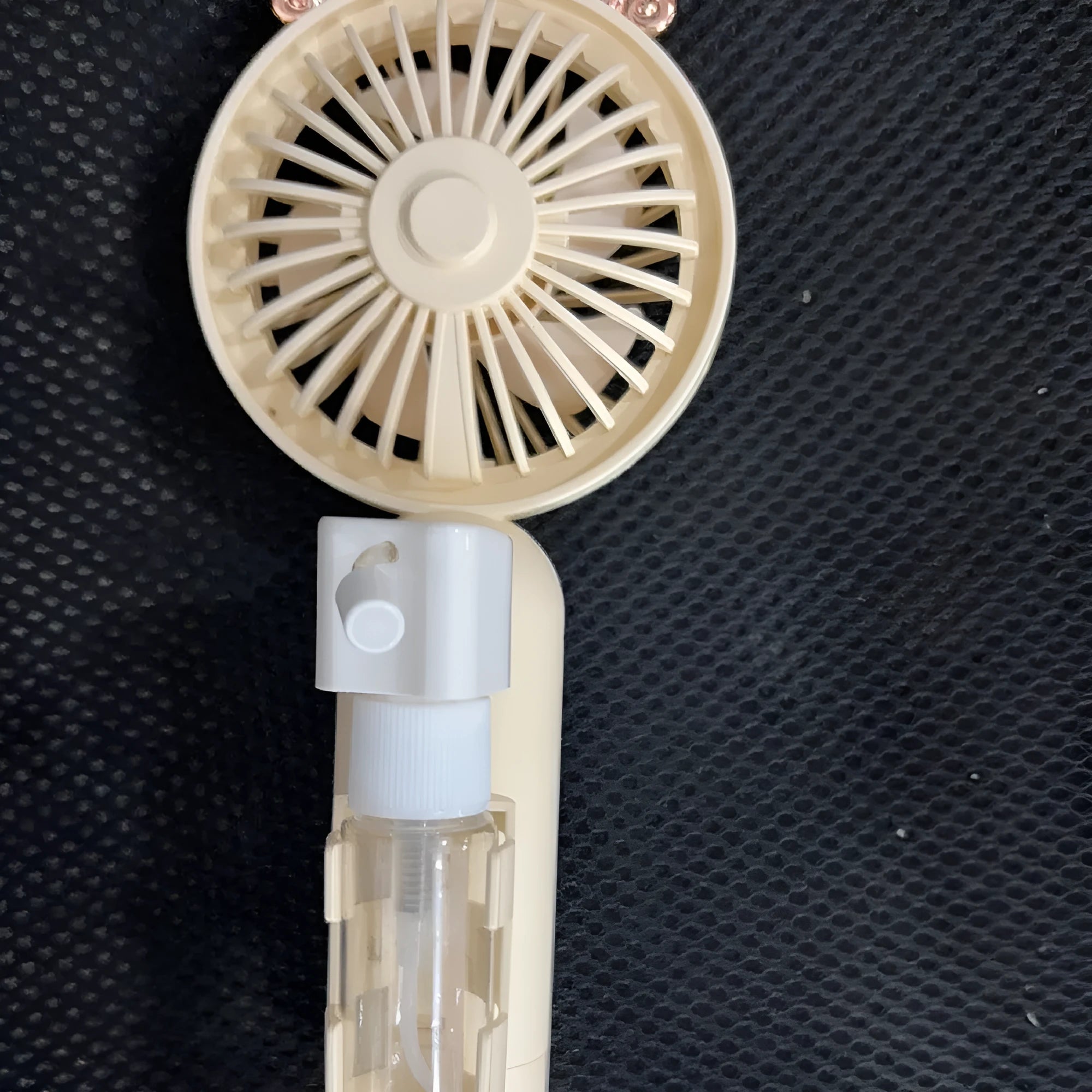 USB rechargeable plastic nozzle fan in apricot, blue, green, orange, and pink colour options.