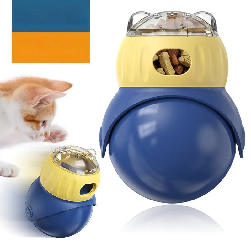 Morandi yellow and blue owl-shaped plastic tumbler cat toy with a snap-fit lid, on a wooden floor.