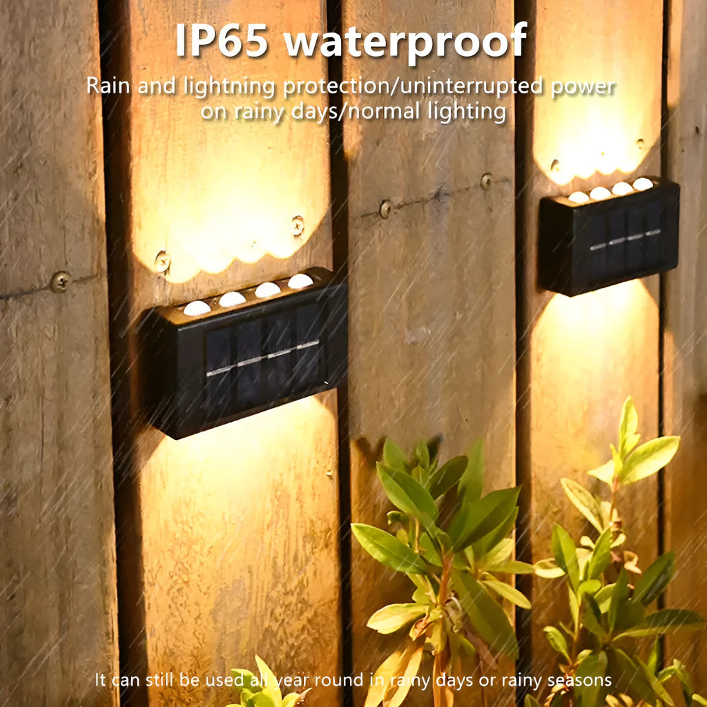 Solar outdoor wall light with up and down glow, black ABS+PC housing, warm white SMD LEDs