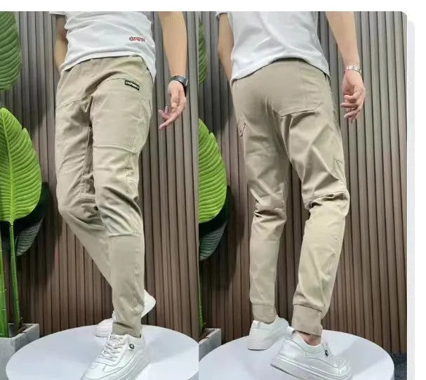 Men's ice silk stitching six-pocket embroidery high elastic casual pants in black, size 29-38