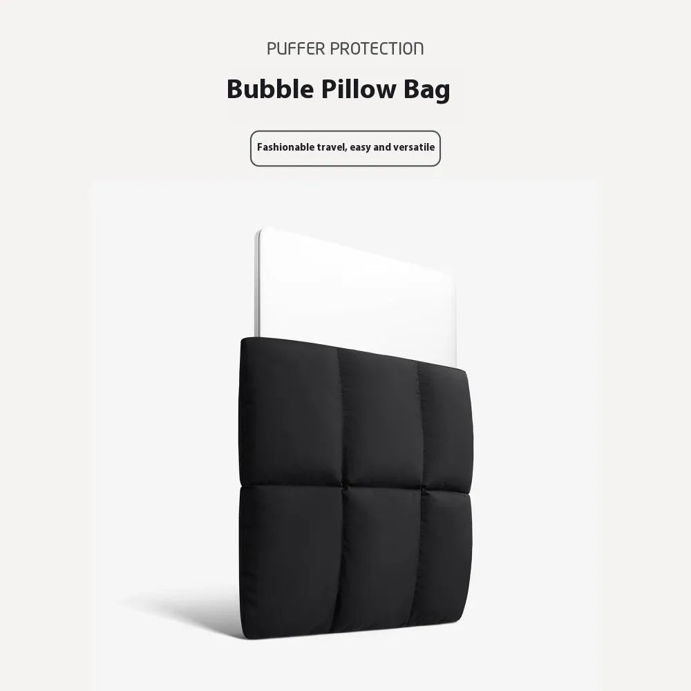 Soft fluffy laptop sleeve in black showing sewing thread details and open to reveal polyester lining