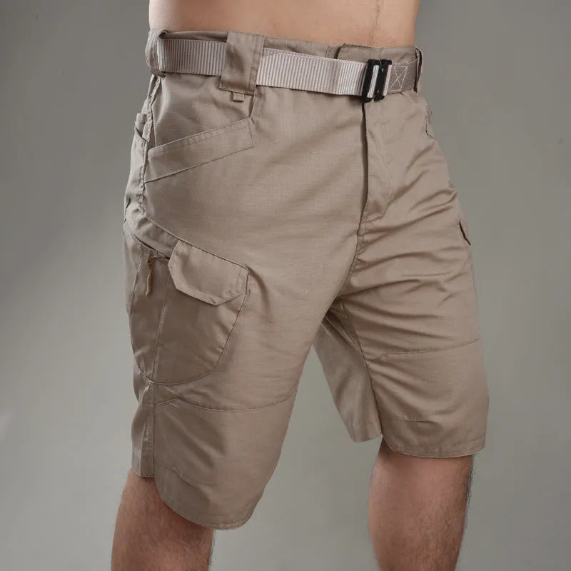 IX7 men's tactical shorts in cotton blend fabric, shown in a camouflage colour with button-fly closure.
