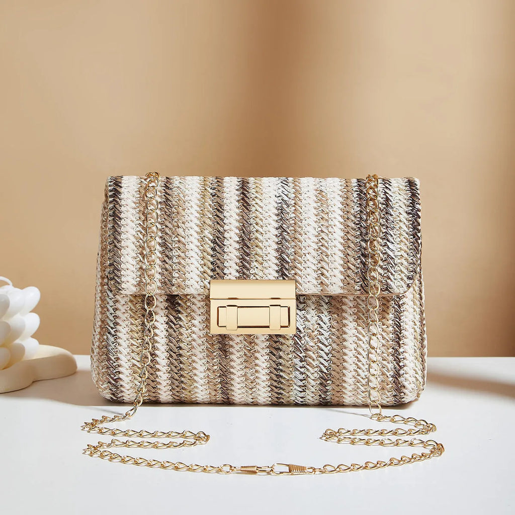 Women's straw cross-body bag with lock detail in rainbow colour showing square shape