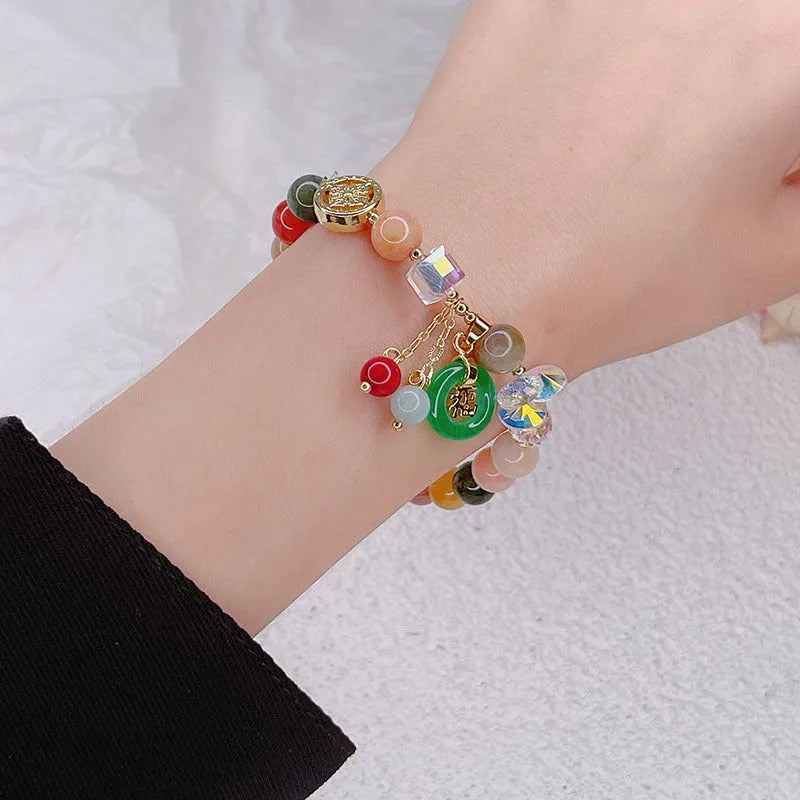 Retro Jinsi Jade bracelet with blessing card and fu character on display