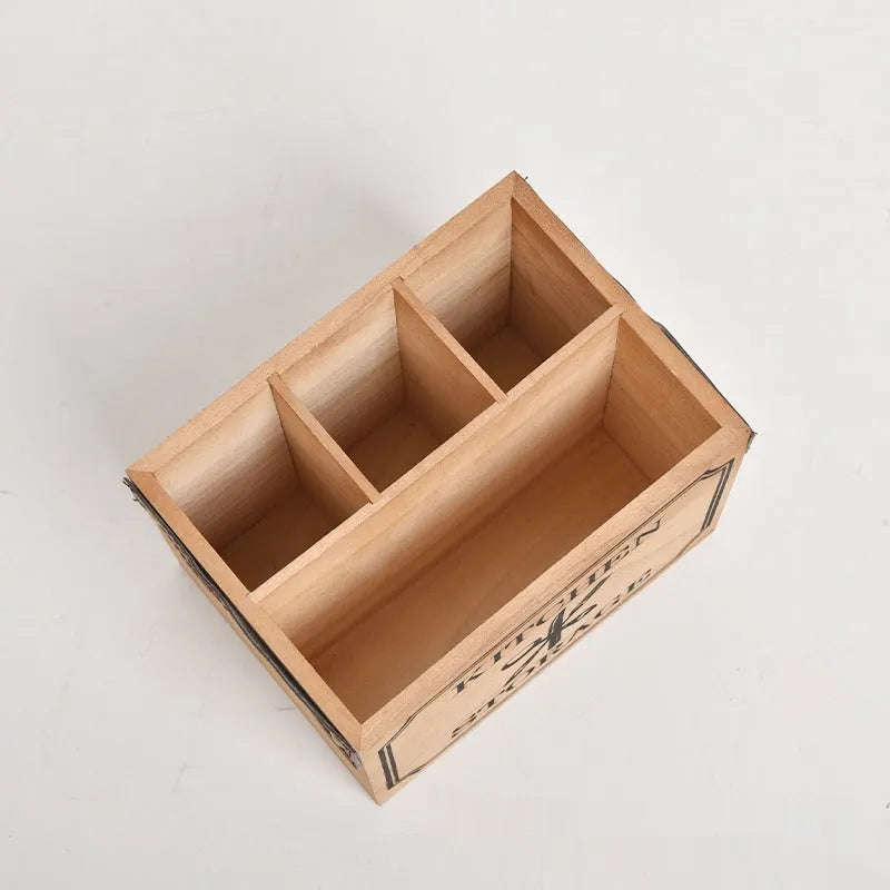 Wooden kitchen storage box with grid compartments for knives, forks, and chopsticks.