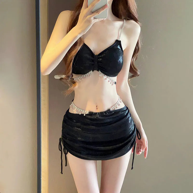 Women's solid colour polyester bikini swimsuit set in black or pink on mannequin
