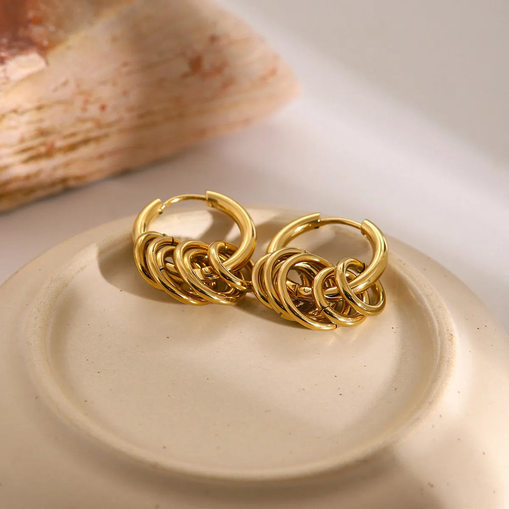 Stainless steel electroplated earrings in INS style, available in two colour options.
