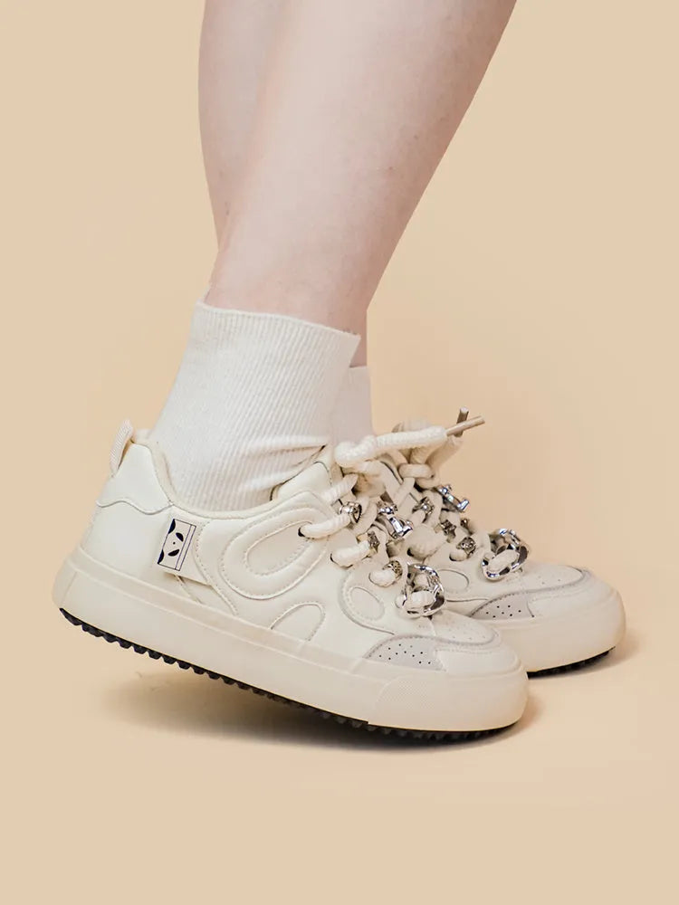 Casual white low-top lace-up sneakers for women with rubber sole and thick bottom heel