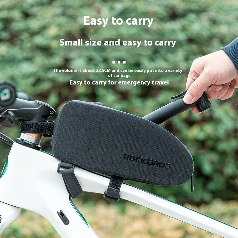 Black plastic portable mini bicycle tire inflator with gas nozzle on white background
