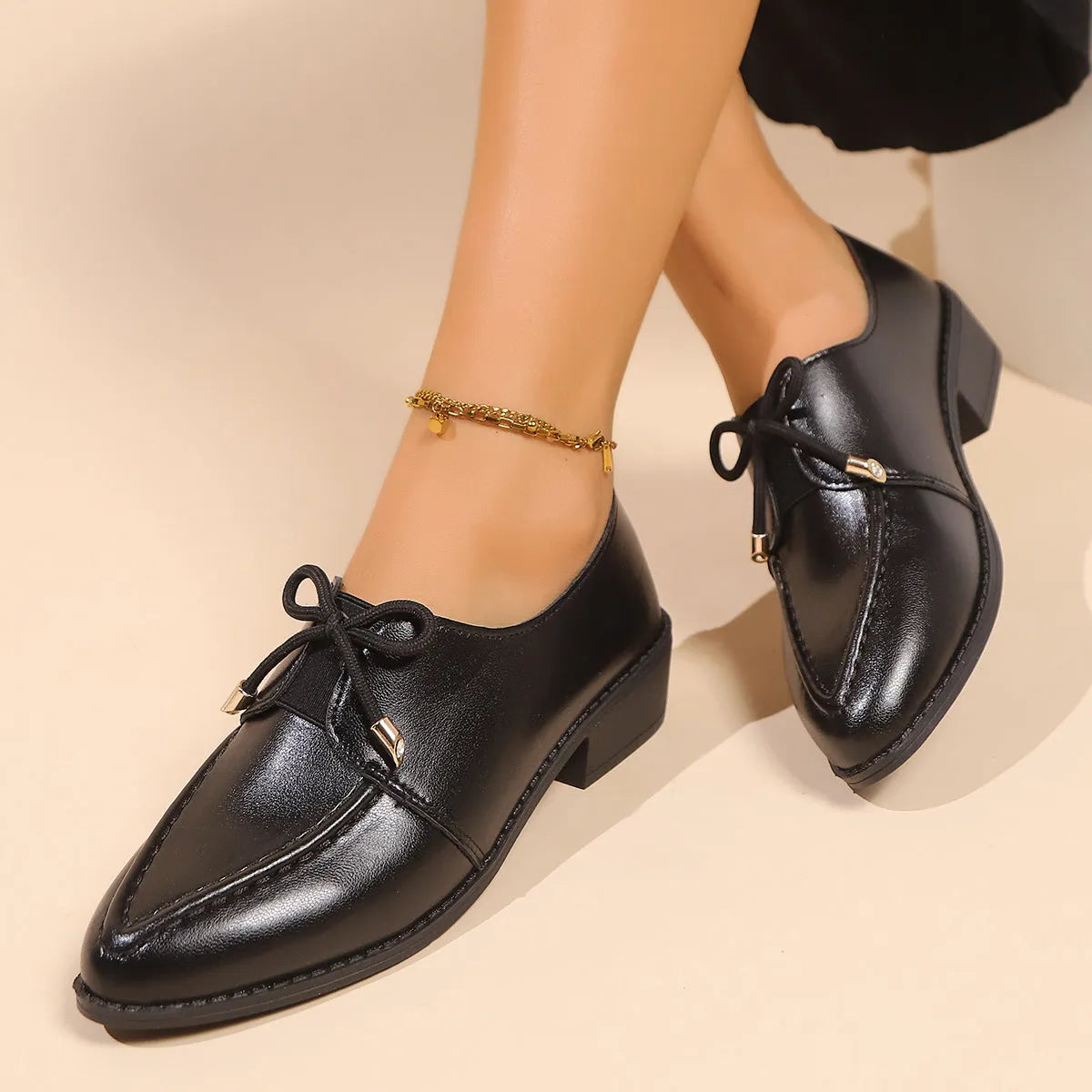 Women's slip-on shoe with a decorative bow on a pointed toe, available in buckle big bow or small bowknot styles.