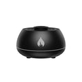 Black flame effect humidifier diffuser with LED lights on a wooden surface